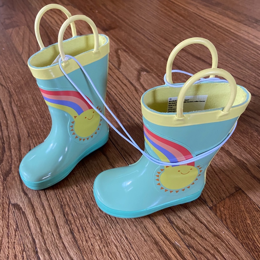 Very cute kids rain boots with clouds & rainbows.